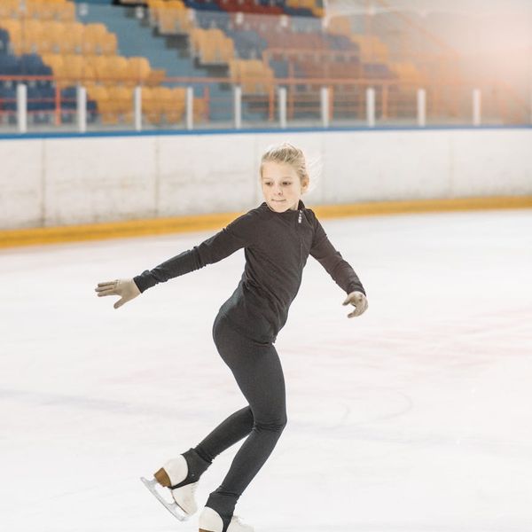 Person in a dynamic yet graceful pose, suggesting energy and flexibility.